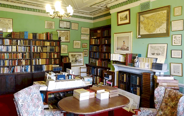 The Antiquarian Room of Bookends Carlisle, complete with maps and chairs